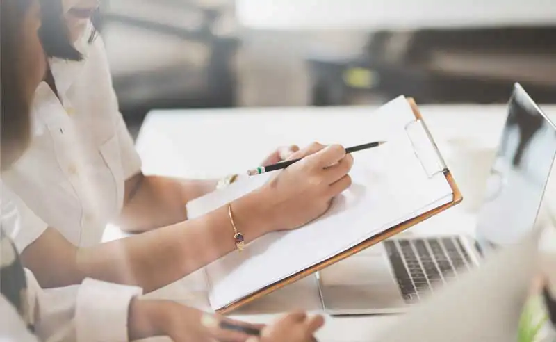 Accounting careers on the Sunshine Coast at Holmans, professional team reviewing financial documents