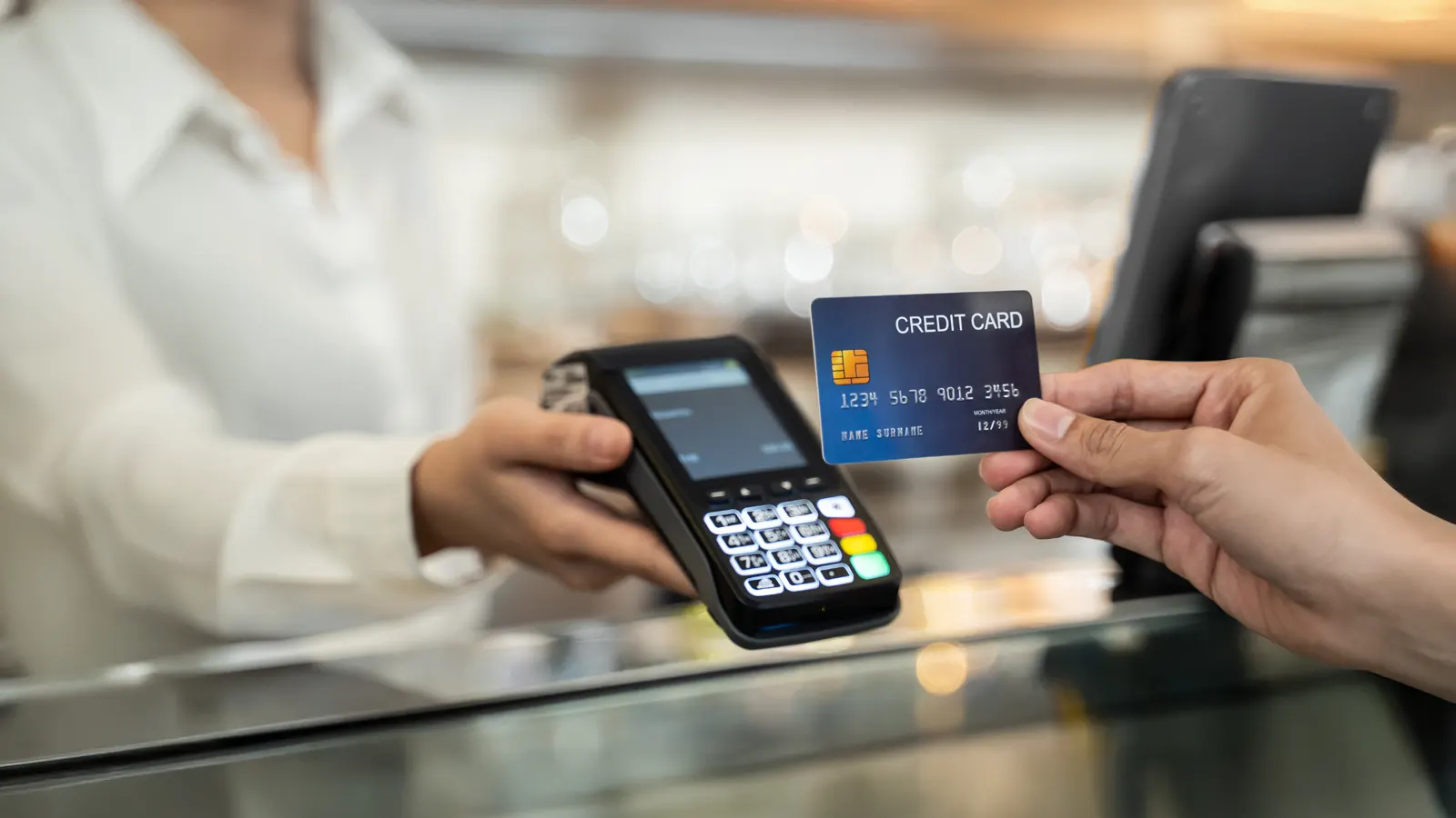 Credit card payment at terminal showing surcharge changes in Australia