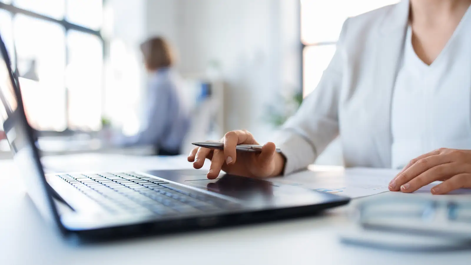 Business owner reviewing payroll and superannuation payments on a laptop