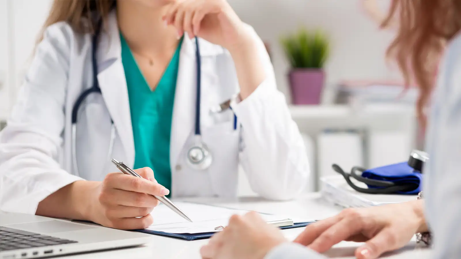 Health professional reviewing employee wages and payroll under new STP and Payday Super rules.